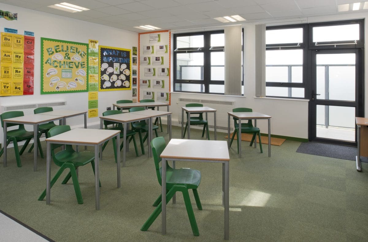 Children's desk in school teaching room